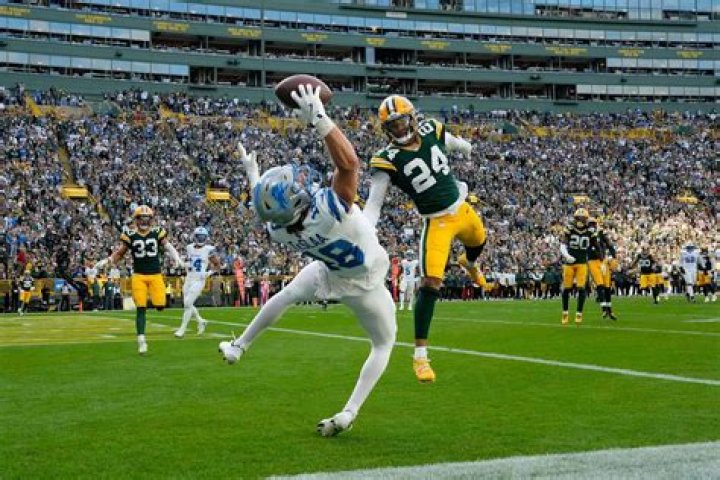 Can a quarterback catch his own pass and throw again?